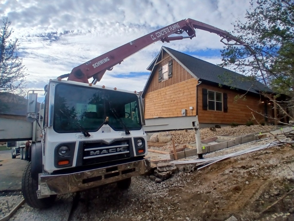 CL Concrete pump truck pouring on a large jobsite